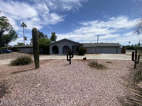 7201 N 16th Dr, Phoenix, AZ 85021 - ranch-style home with concrete driveway and an attached garage