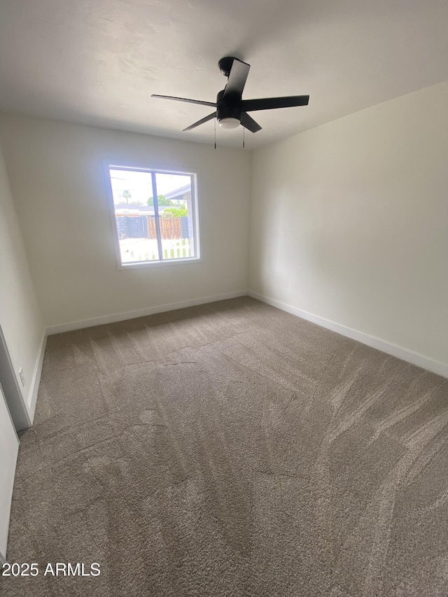7201 N 16th Dr, Phoenix, AZ 85021 - unfurnished room featuring a ceiling fan, carpet floors, and baseboards