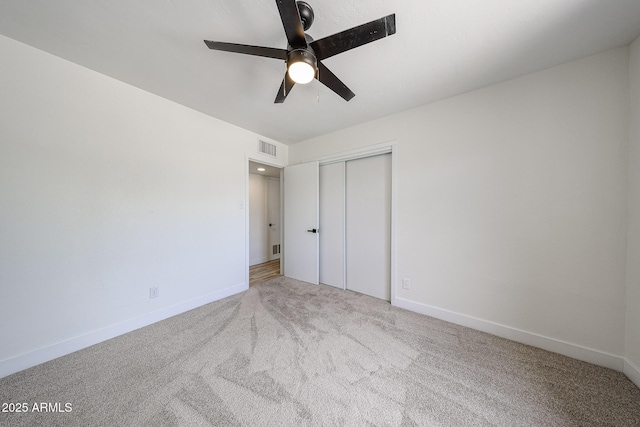 7201 N 16th Dr, Phoenix, AZ 85021 - unfurnished bedroom with carpet floors, a closet, baseboards, and a ceiling fan