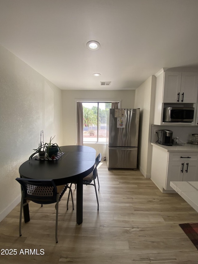 7201 N 16th Dr, Phoenix, AZ 85021 - dining space with baseboards, light wood finished floors, and recessed lighting