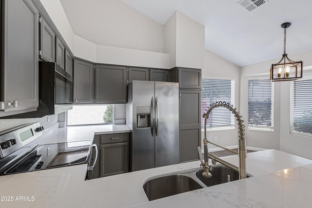 kitchen with visible vents, appliances with stainless steel finishes, an inviting chandelier, and a healthy amount of sunlight