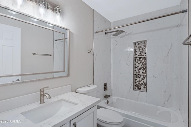 bathroom featuring a textured wall, vanity, toilet, and tub / shower combination