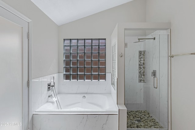 full bathroom with a garden tub, a marble finish shower, and lofted ceiling