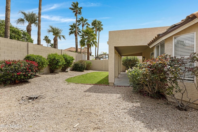 view of yard with a patio area and a fenced backyard