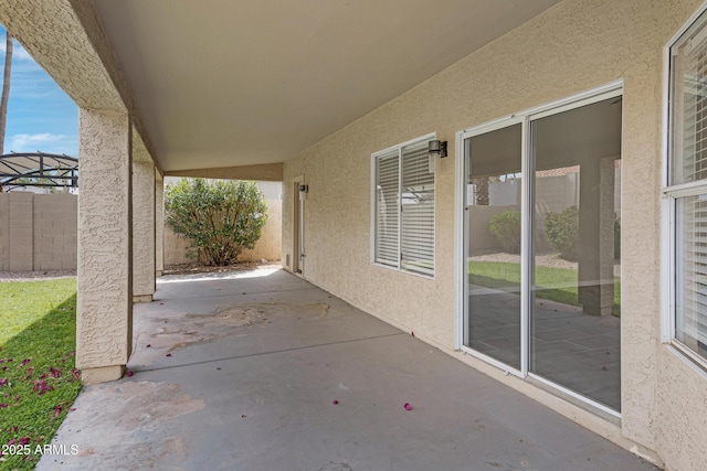 view of patio featuring fence