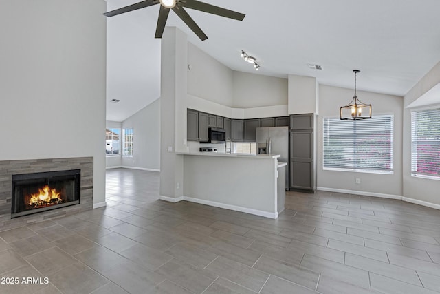 kitchen featuring open floor plan, a ceiling fan, gray cabinetry, visible vents, and appliances with stainless steel finishes