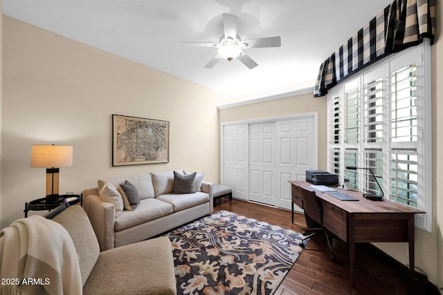 living room with ceiling fan and wood finished floors