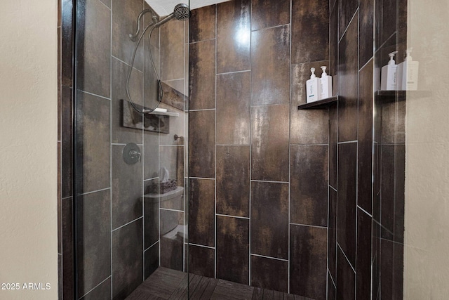 full bathroom with tiled shower