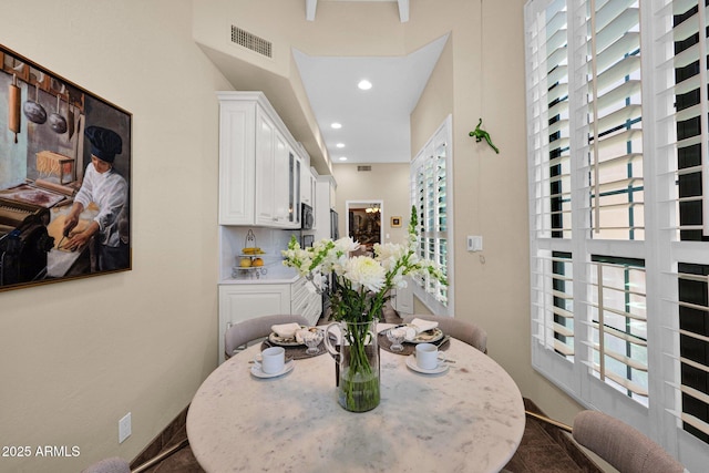 dining space featuring baseboards, recessed lighting, and visible vents