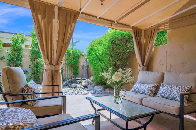 exterior space featuring an outdoor living space and a fenced backyard
