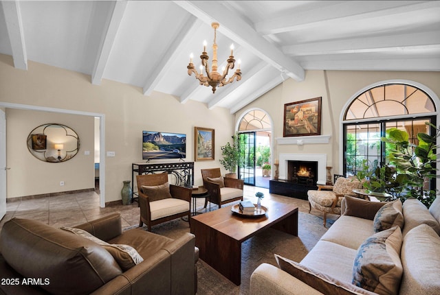 living room featuring a lit fireplace, baseboards, an inviting chandelier, and lofted ceiling with beams