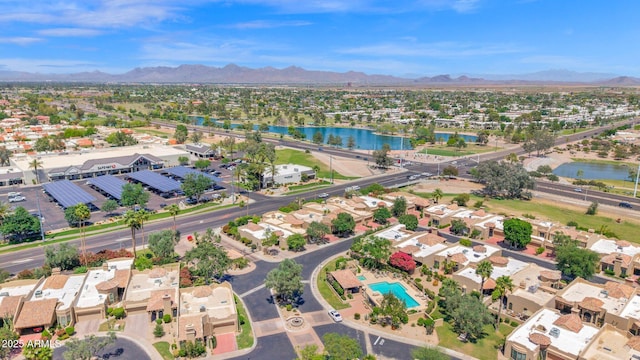 birds eye view of property featuring a water and mountain view and a residential view