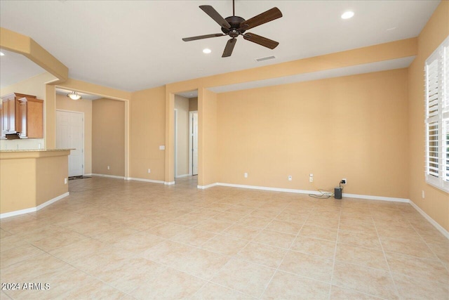 unfurnished living room featuring ceiling fan