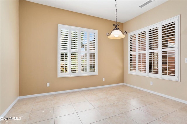 empty room featuring light tile patterned flooring