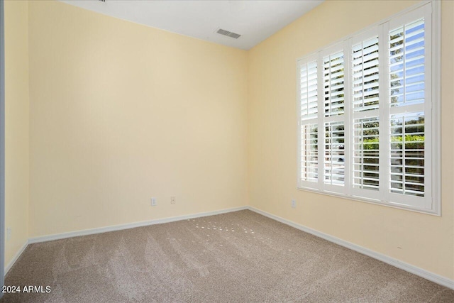 empty room featuring carpet flooring