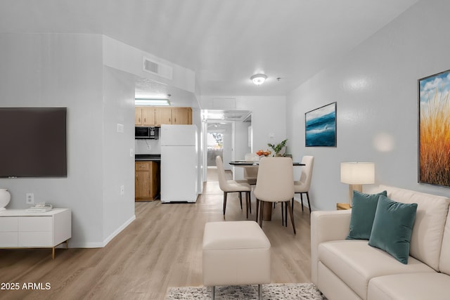 living room featuring light hardwood / wood-style floors