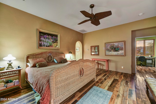 bedroom with ceiling fan and dark hardwood / wood-style floors