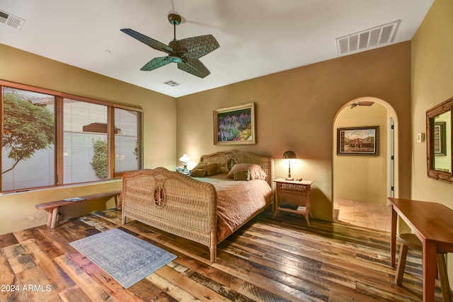 bedroom with hardwood / wood-style floors and ceiling fan