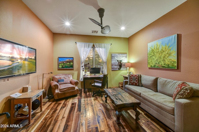 living room featuring hardwood / wood-style floors and ceiling fan