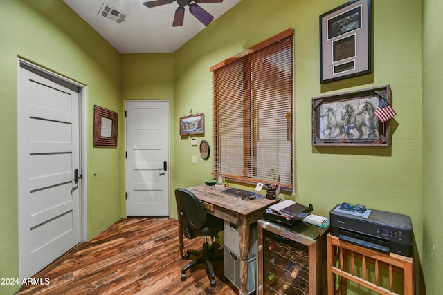 home office featuring hardwood / wood-style floors and ceiling fan