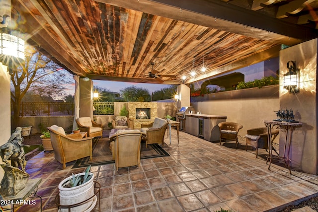 patio terrace at dusk with ceiling fan and an outdoor living space