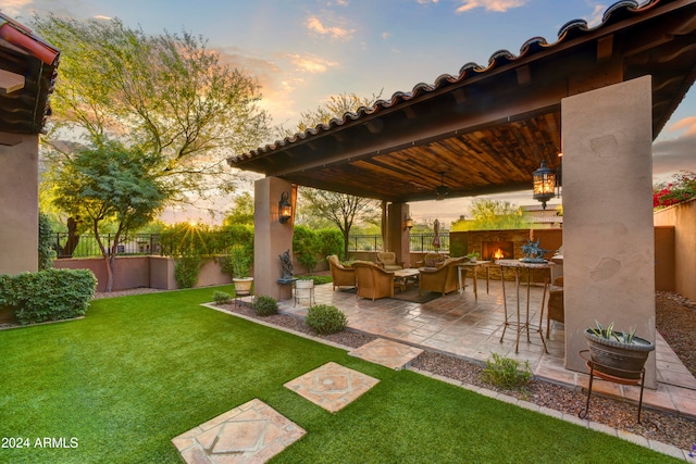 patio terrace at dusk with a yard