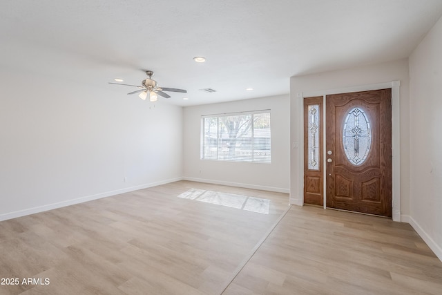 entryway with ceiling fan and light wood-type flooring