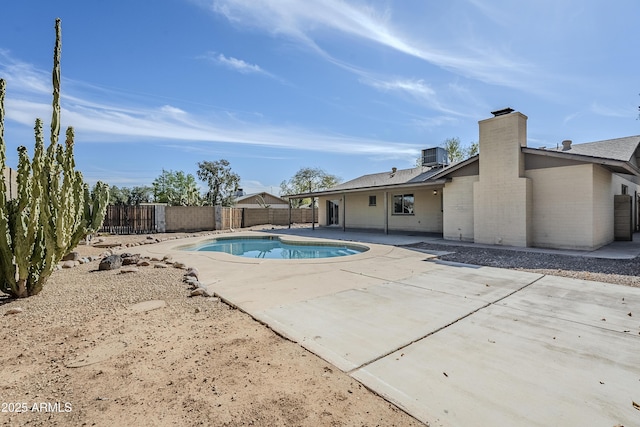 view of pool featuring a patio and cooling unit