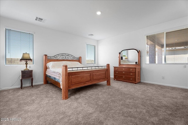 bedroom with baseboards, visible vents, and carpet floors