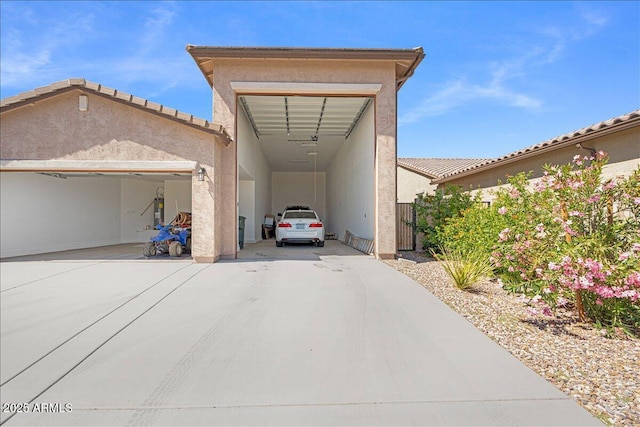 exterior space featuring concrete driveway