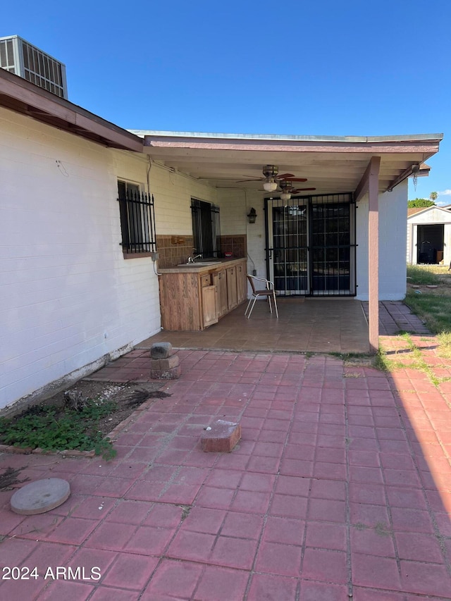 view of patio / terrace featuring ceiling fan and sink