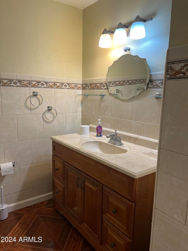 bathroom featuring tile walls and vanity