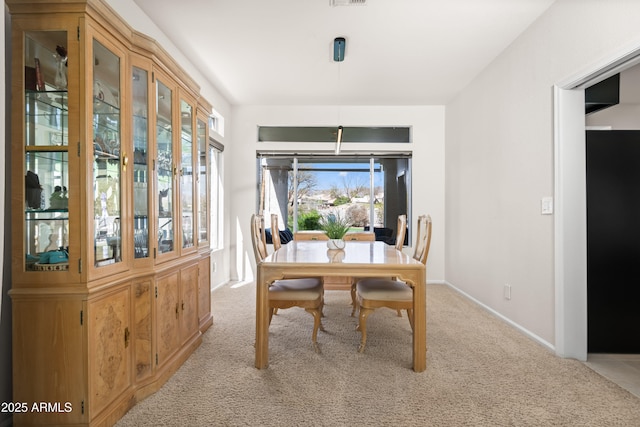 dining space featuring carpet flooring, visible vents, and baseboards