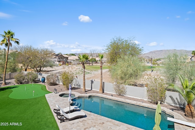 view of swimming pool with a mountain view, a fenced in pool, a patio, and a fenced backyard