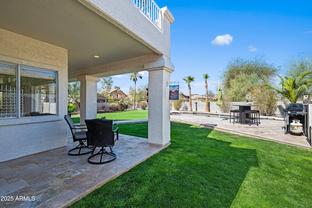 view of yard featuring fence and a patio area