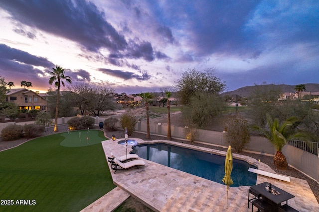 view of pool featuring a patio, a fenced backyard, and a fenced in pool