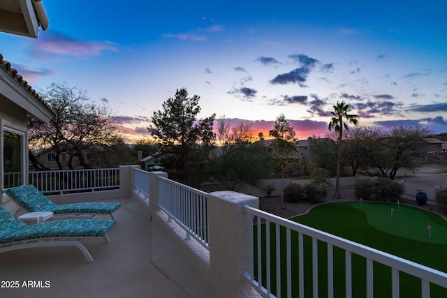 view of balcony at dusk