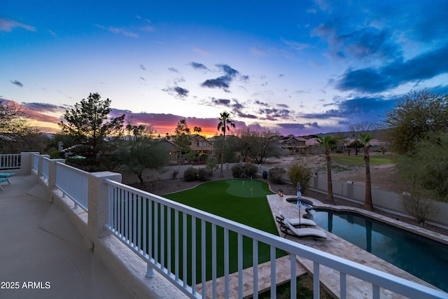 view of balcony at dusk