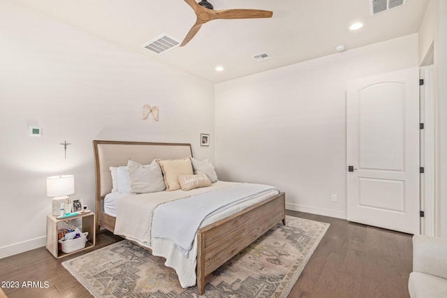 bedroom with ceiling fan and dark wood-type flooring