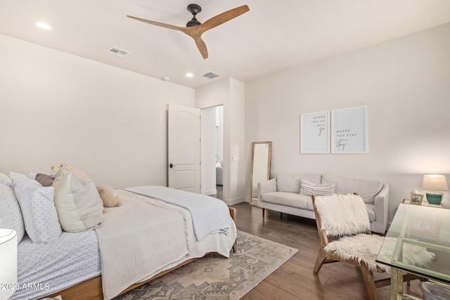 bedroom with ceiling fan and dark hardwood / wood-style floors