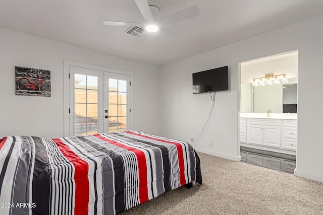 carpeted bedroom featuring ceiling fan, ensuite bathroom, access to outside, and french doors