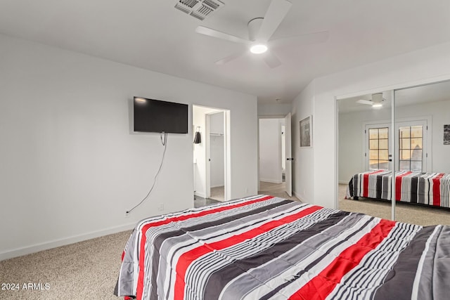 bedroom featuring ceiling fan and a closet