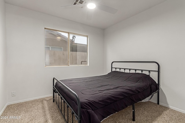 bedroom with ceiling fan and carpet