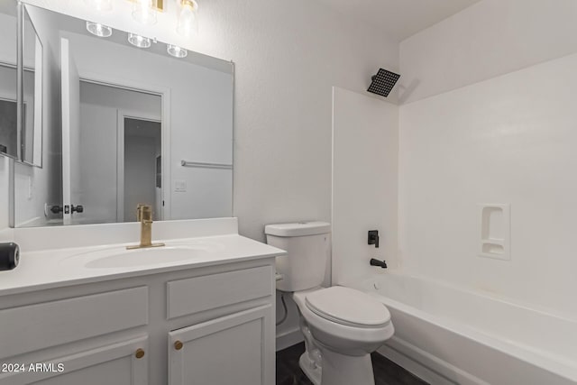 full bathroom featuring tub / shower combination, toilet, and vanity