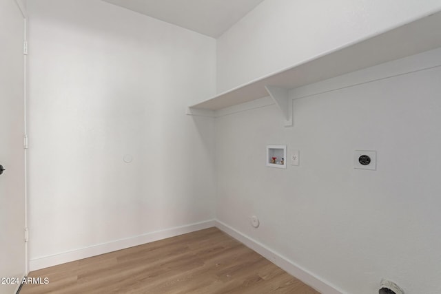 laundry room featuring washer hookup, hookup for a gas dryer, wood-type flooring, and hookup for an electric dryer