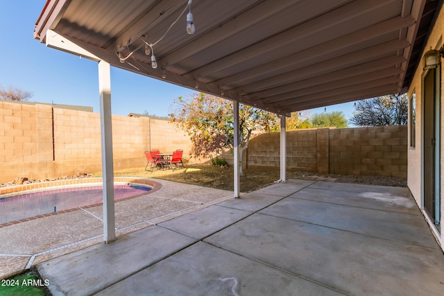 view of patio / terrace featuring a fenced in pool