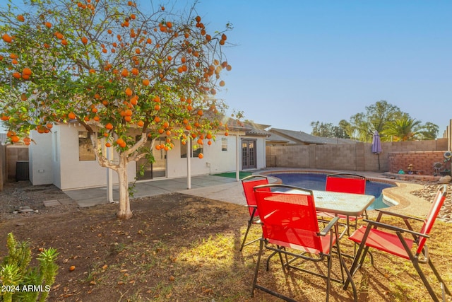 view of pool featuring french doors and a patio area