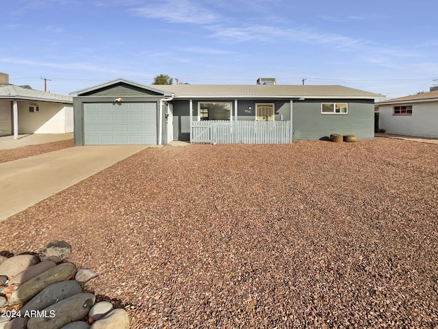 ranch-style home featuring a garage