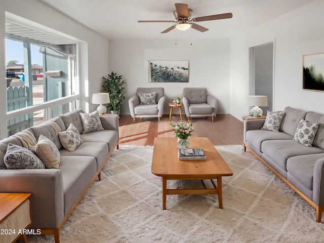 living room featuring hardwood / wood-style flooring and ceiling fan