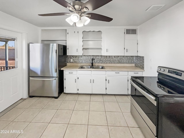 kitchen with ceiling fan, sink, tasteful backsplash, white cabinets, and appliances with stainless steel finishes